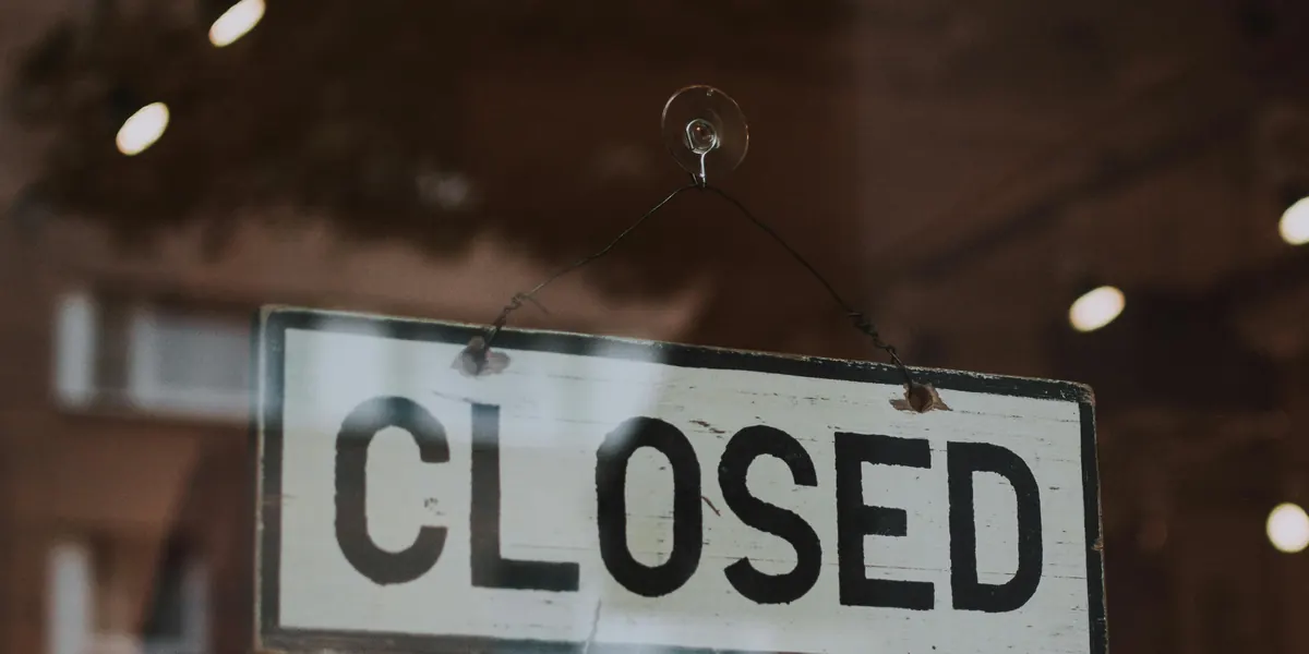 Closed sign hanging in a shop window