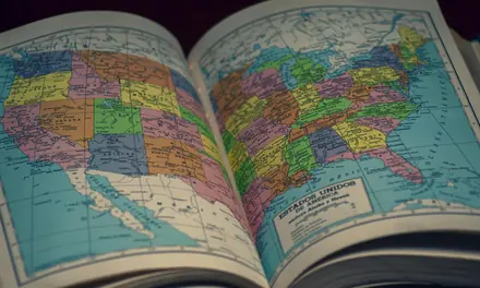 Open atlas showing a map of the United States and its states