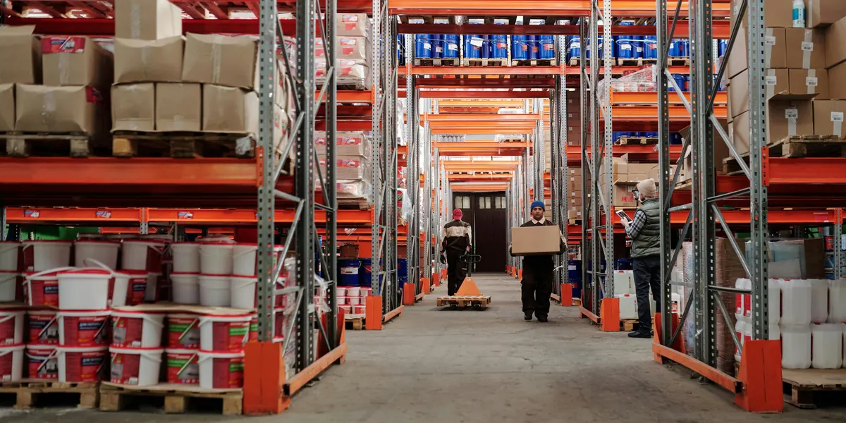 Warehouse aisle with pallet racks full of goods